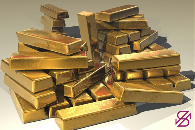 تصویر تعداد زیادی شمش طلا در کنار ریخته شده روی هم 