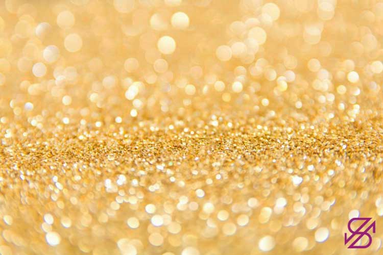 تصویر گرده‌های طلایی رنگ روی سک سطح 